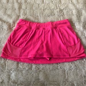 Pink fitted athletic skort; size large